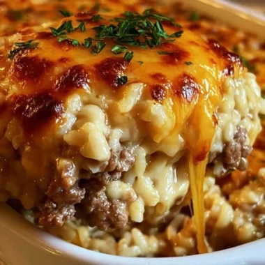 Cheesy ground beef rice casserole in a baking dish, ready to serve.