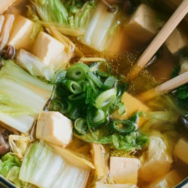 Bowl of delicious Napa Cabbage Tofu Soup with fresh ingredients