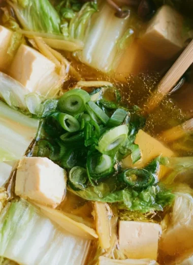 Bowl of delicious Napa Cabbage Tofu Soup with fresh ingredients