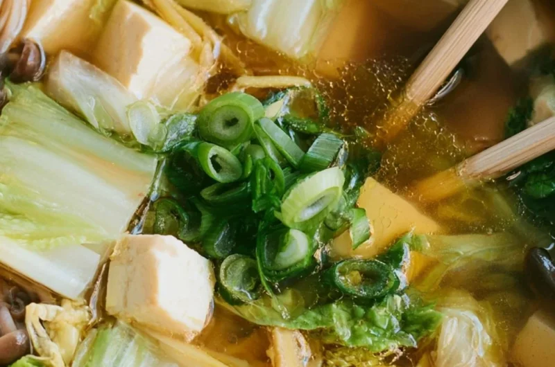 Bowl of delicious Napa Cabbage Tofu Soup with fresh ingredients