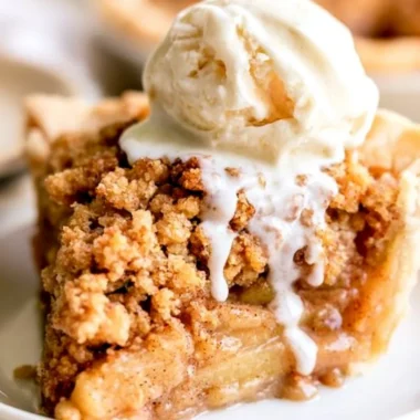 Delicious homemade Dutch Apple Pie with a crumbly topping and spiced apple filling.