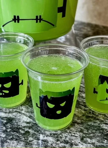 Vibrant Frankenstein Green Punch served in a Halloween-themed glass