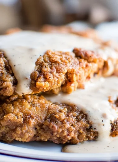 Delicious Texas Chicken Fried Steak served with gravy and sides.