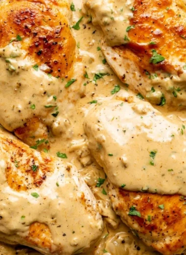 Creamy Boursin Chicken dish served on a plate with herbs and sides.