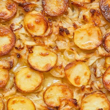 Baked potatoes with onions served at a family gathering, recipe from 1952.
