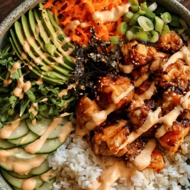 Delicious sticky honey ginger chicken bowls served with vegetables and rice