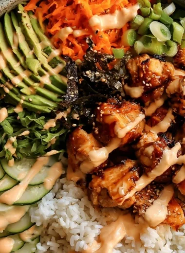 Delicious sticky honey ginger chicken bowls served with vegetables and rice